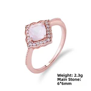 Macro detail of a rose gold ring with a 6x6mm pink square stone and 2.3g silver band