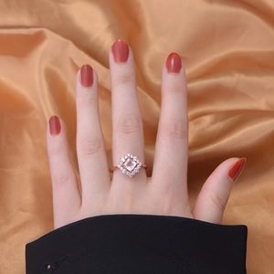 925 silver rose gold ring featuring cushion cut rose quartz and surrounding diamonds