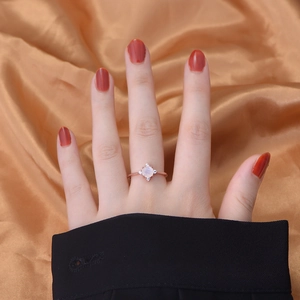 925 silver moonstone ring with rose gold finish and cross diamond accents on gold silk