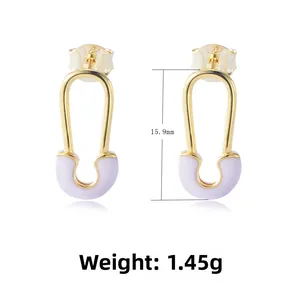 Close-up of golden paperclip earrings with purple enamel and S925 silver hallmark