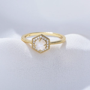 Vintage sterling silver ring with hexagonal moonstone halo and golden beaded band