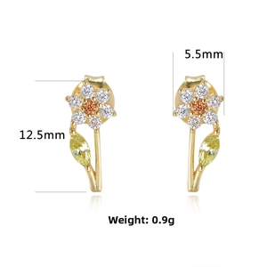 Macro detail of s925 silver flower stud earring with orange zircon and 12.5mm length