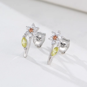 Macro view of S925 sterling silver flower stud earrings with vibrant colorful zircons