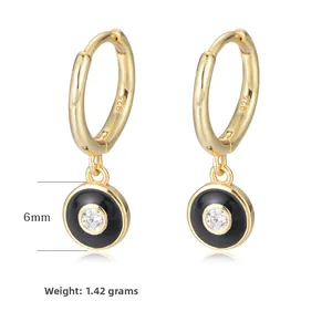 Detail of S925 silver gold-plated earrings with black enamel and 6mm zircon inlay