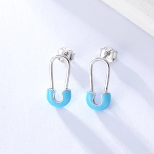Macro view of S925 sterling silver safety pin earrings with blue enamel and 925 hallmark