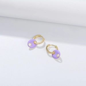 Detail of 925 sterling silver gold earrings with purple enamel and zircon inlay