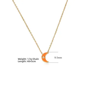 Detailed view of s925 silver gold-plated necklace with orange moon pendant and cubic zirconia