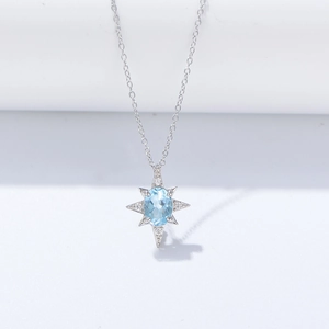 S925 Sterling Silber Stern Anhänger mit ovalem blauem Topas und Zirkonia Akzenten