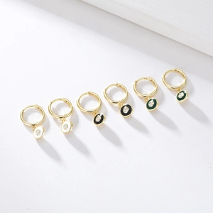 Detail of S925 silver C-shape enamel hoop earrings with zircons in various colors