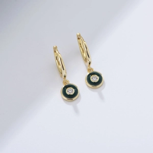 Detail of S925 silver gold-plated earring with green enamel and sparkling zircon stone