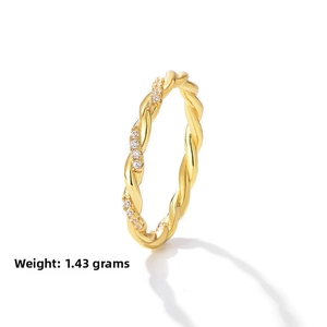 Detail of twisted gold ring weighing 1.43g with shimmering paved cubic zirconia stones