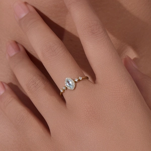 925 sterling silver ring featuring marquise blue topaz and micro-pave zircons on hand