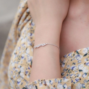 Close-up of s925 silver MAMA letter bracelet with shimmering pave zircon stones
