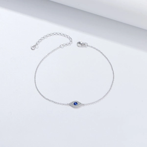 Silver Evil Eye bracelet with blue zircon and micro-pave crystals on white background