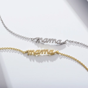 Macro detail of gold and silver S925 sterling silver mama bracelets with zircon stones