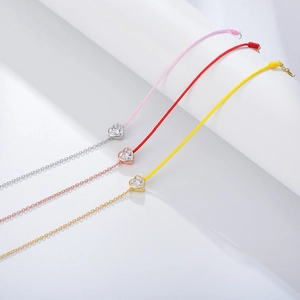 Sterling silver heart zircon bracelets with colorful cords in silver, gold, and rose gold