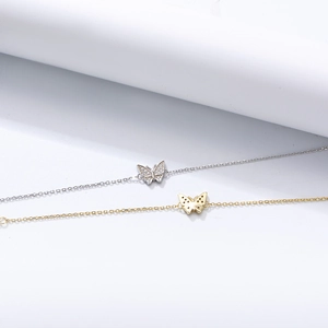 Detailed view of S925 sterling silver butterfly bracelets with pavé zircons and gold finish