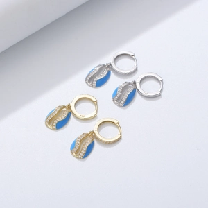 Elegant S925 silver wave earrings with blue enamel and pavé diamonds in gold and silver