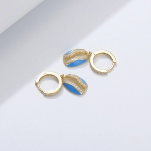 Detailed view of S925 silver earring featuring blue enamel shell and sparkling crystals