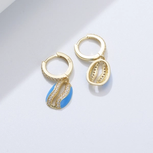 Detailed close-up of S925 silver gold-plated shell earrings with blue enamel and zircons