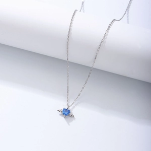 Detailed view of s925 silver angel wing necklace with heart-shaped blue zircon pendant