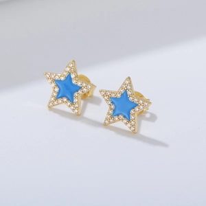 Macro detail of blue enamel star stud earrings with micro-set cubic zirconia accents