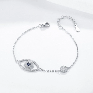 Macro detail of S925 sterling silver evil eye bracelet with blue and white zircon stones