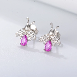 Detailed view of silver bee stud earrings with pink drop stone and zircon wings