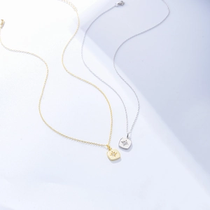 Minimalist silver and gold starburst square pendant necklaces with cubic zirconia accents