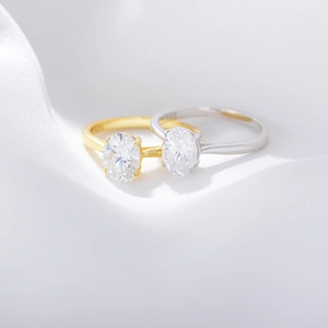 S925 sterling silver oval zircon wedding rings in gold and silver finish with silk background