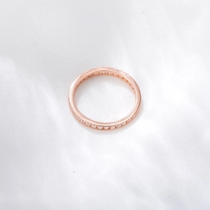 Detailed close-up of S925 silver eternity ring with rose gold finish and pavé cubic zirconia