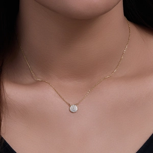 Classic round cubic zirconia pendant necklace in gold finish on a female model