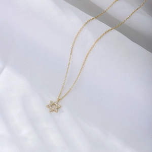 Elegant gold S925 silver hexagram pendant necklace with micro-paved zircons on white fabric