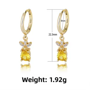 Macro shot of S925 sterling silver stamp on golden pineapple zircon hoop earrings