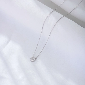 Classic S925 sterling silver necklace with round pavé zirconia pendant on white silk