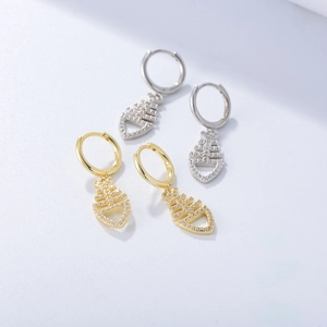 Macro detail of S925 sterling silver fishbone earrings with sparkling zircon stones