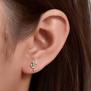 S925 silver cactus stud earrings with micro-set green cubic zirconia worn on ear