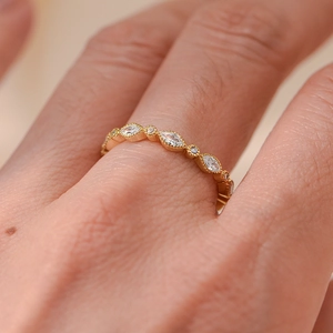 Macro view of gold s925 silver ring featuring marquise and round cut sparkling diamonds