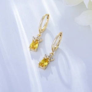 Macro detail of S925 sterling silver stamp on pineapple drop earrings with yellow zircon