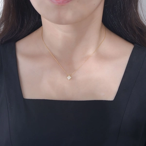Minimalist gold square pendant necklace with sparkling cubic zirconia on a female model