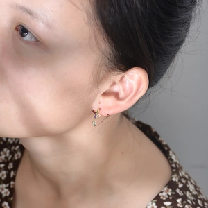 Colorful zircon asymmetrical cross drop earrings with red yellow and purple gems