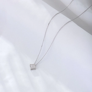 Sterling silver necklace with square pavé zircon pendant on white satin fabric