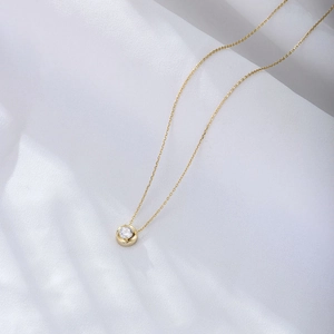 Elegant 925 sterling silver gold-plated necklace featuring a brilliant round zircon pendant