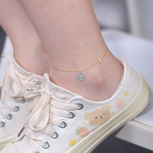 Charming gold-tone daisy and butterfly anklet for women with light blue enamel flower