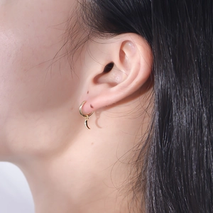 Minimalist S925 silver crescent moon hoop earrings with cubic zirconia on model