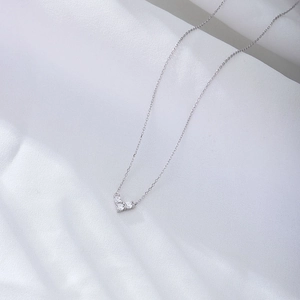 Luxurious sterling silver necklace with three sparkling heart-shaped diamond pendants