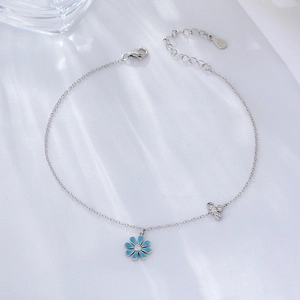 Minimalist S925 sterling silver daisy anklet featuring blue flower and butterfly charms