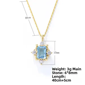 Detail of s925 silver necklace featuring a rectangular sky blue topaz pendant with gold finish