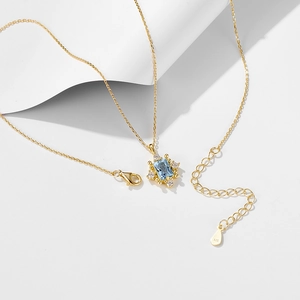Detailed macro of S925 silver clasp and 925 hallmark on a luxury topaz pendant chain