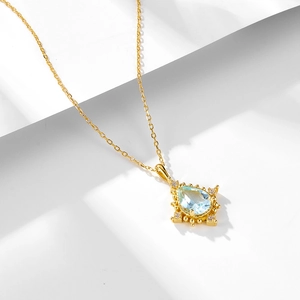 925 silver necklace featuring a pear-cut sky blue topaz pendant with vintage bead edge